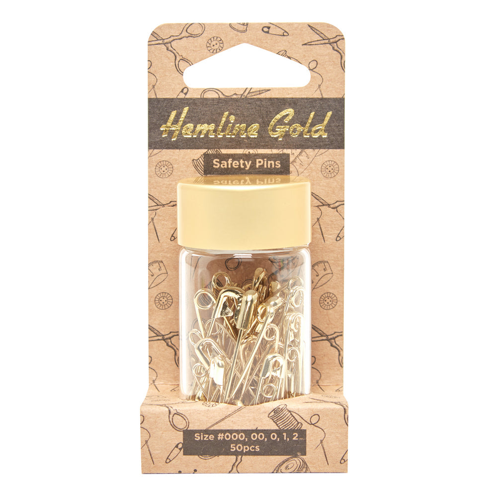 Glass tube of 50 matching dirty pins - gold